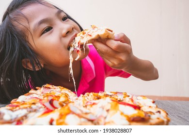 Pizza And Kids Concept, Slices Pizza Portion On Hand To Eating, Fast Food Snack For Tasty And Delicous On Table, Many Cheese In Surface For Order Delivery, Happy Time For Hungry Children In Family