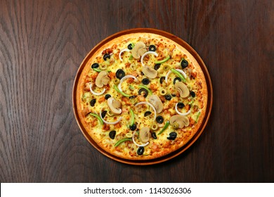 Pizza with loads of cheese and extra toppings 
