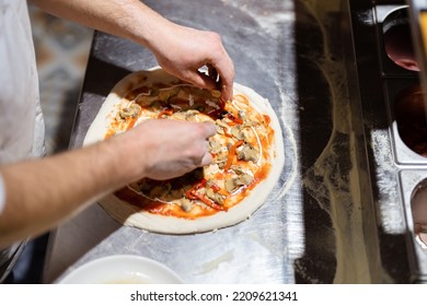 Pizza Making Process. Male Chef Hands Making Authentic Pizza In The Pizzeria Kitchen.