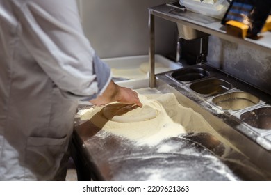 Pizza Making Process. Male Chef Hands Making Authentic Pizza In The Pizzeria Kitchen.