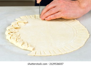 Pizza Making Process. Top View Of Pizza Dough Base. Home-baking Pizza With A Braided Pie Crust. Close Up