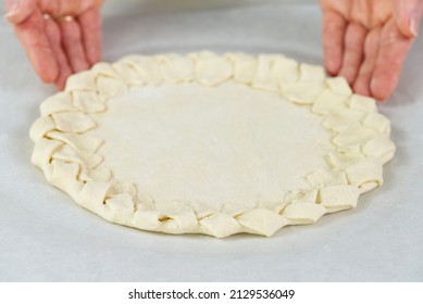 Pizza Making Process. Top View Of Pizza Dough Base. Home-baking Pizza With A Braided Pie Crust. Close Up