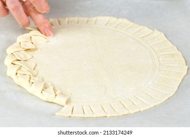 Pizza Making Process. Top View Of Pizza Dough Base. Home-baking Pizza With A Braided Pie Crust. Close Up