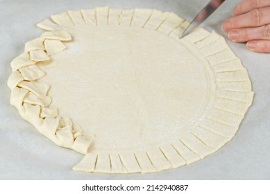 Pizza Making Process. Top View Of Pizza Dough Base. Home-baking Pizza With A Braided Pie Crust. Close Up