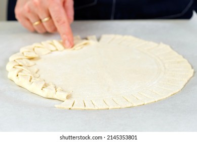 Pizza Making Process. Top View Of Pizza Dough Base. Home-baking Pizza With A Braided Pie Crust. Close Up