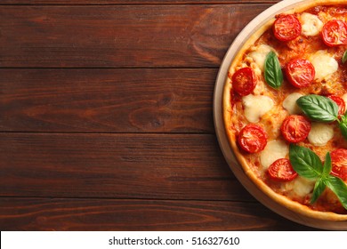 Pizza Margarita On Wooden Background