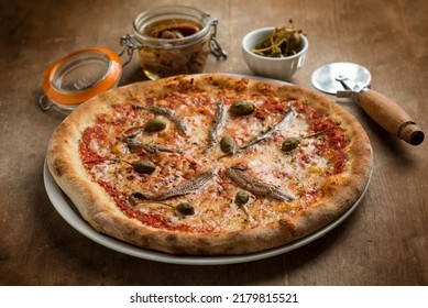 pizza margherita with capers and  anchovies