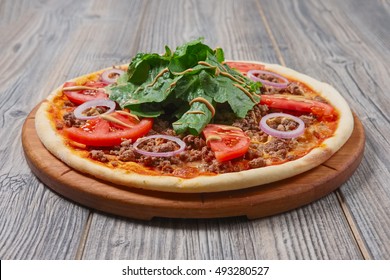 Pizza With Meat On Wooden Table, Side View.