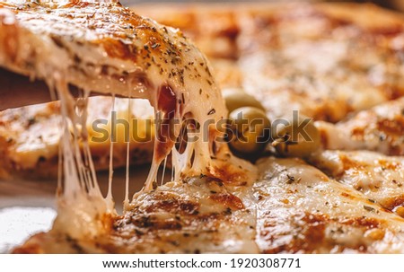 pizza with melting cheese clesup