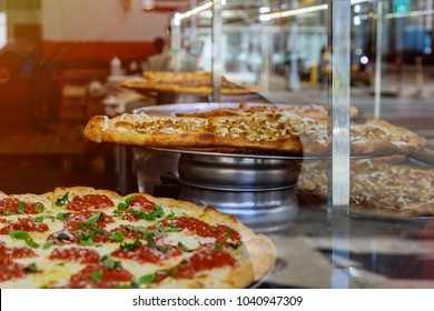 Pizza On A Wooden Counter Of Large Slice Of Pizza New York Style