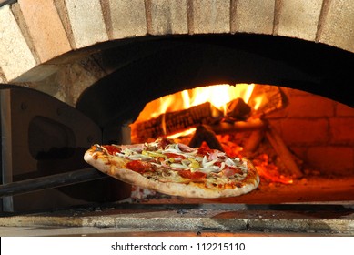 Pizza out of bread oven