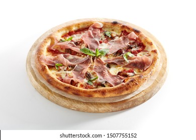 Pizza With Parma Ham, Porcini Mushrooms, Mozzarella Cheese, Fresh Basil, Cherry Tomatoes, Pesto And Tomato Sauce Isolated On White Background. Traditional Italian Whole Flatbread On Wood Close Up