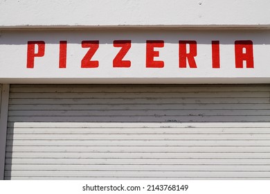 Pizza Pizzeria Restaurant Red Sign Old Vintage On Street Outside View Of Rustic Text On Wall Facade 