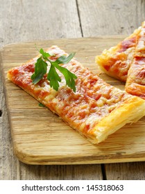 Pizza Of Puff Pastry With Tomato Sauce And Parsley