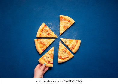 Pizza Quattro Formaggi Made At Home. Sliced Pizza On Blue Background, Above View. Italian Pizza Made With 4 Types Of Cheese.