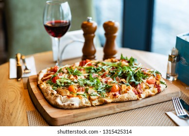 Pizza And Red Wine In The Restaurant