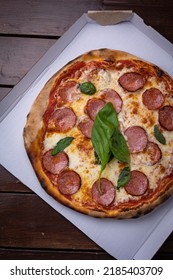 Pizza With Salami, Chees, Tomatoes And Basil. Fast Food. Street Food 