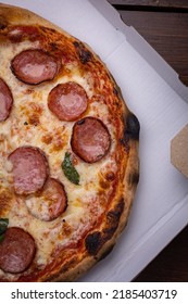 Pizza With Salami, Chees, Tomatoes And Basil. Fast Food. Street Food 