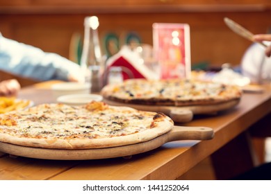 Pizza With Shallow Depth Of Field. Table In A Pizzeria Outside. Beer Garden.