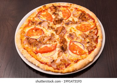 Pizza With  Shawarma Meat Made In A Pakistani Restaurant On A Wooden Table