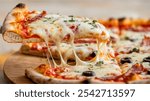 Pizza Slice: A golden-brown pizza slice with melted cheese, bacon, olives, and herbs, being lifted from a wooden board, set against a blurred background.