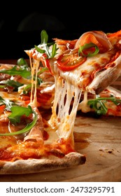 The pizza is stringy when pulled because of the hot cheese