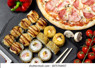 Pizza and sushi rolls tempura and bake rolls on the background of ingredients .Pizza, sushi food photo for menu. Combo set of rolls and pizza. - Shutterstock ID 1875744457