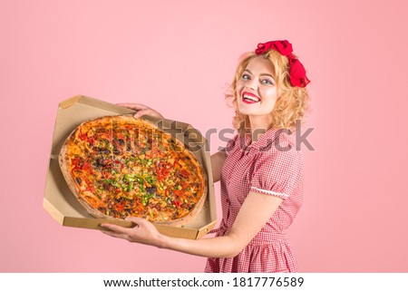 Pizza time. Fast food. Pizza delivery. Italian food. Lunch. Delicious, tasty food. Baking, lunch and people concept. Happy pin up woman holds big pizza in box.