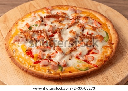 Pizza topped with bamboo worm, pupa, silkworm edible insect crispy mixed with sausage slices, sweet pepper and mozzarella cheese, Fried insects are the most widely sold street food in Thailand.