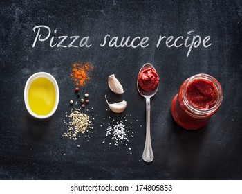 Pizza Topping Sauce Ingredients Or Recipe On Black Background. Tomato Puree, Olive Oil, Garlic, Oregano, Salt And Pepper From Above - Cooking Food.