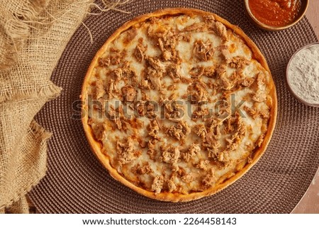 Pizza with tuna top view on
