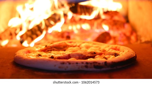 A Pizza In A Wood Fired Oven , On Fire