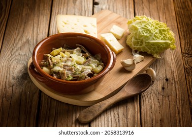 Pizzoccheri pasta with ingredients over wooden background