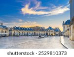 Place de la Liberation square in Dijon city historical centre with old buildings, street restaurants and cafes, Dijon old town evening view on twilight dusk, Bourgogne-Franche-Comte region, France