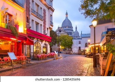 The Place du Tertre with tables of cafe and the Sacre-Coeur in the morning, quarter Montmartre in Paris, France