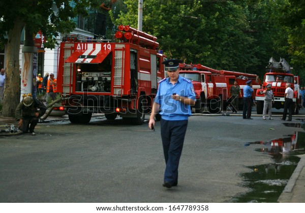 Place of incident. Fire trucks, police and\
military. Fire in surrender in the city center. Firefighters Work\
Concept. Dnipro / Ukraine -\
08.10.2010