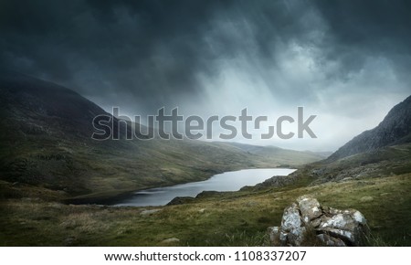 A place of myths and legends. Wild weather and terrain make for good adventures. Mountains and lakes landscape. Photo composite.