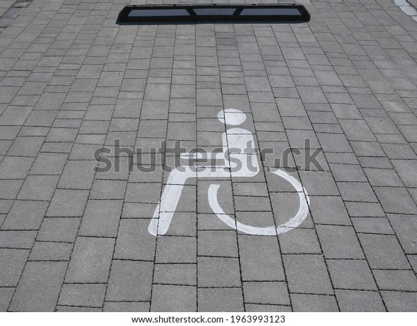 A\
place in the parking lot for a disabled person\'s\
car.