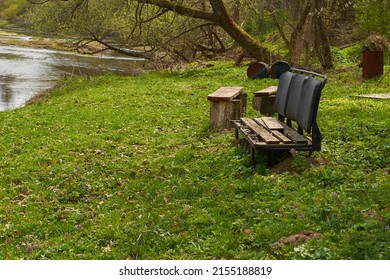 A Place To Rest. A Bench Made From An Old Broken Car Seat On The Riverbank