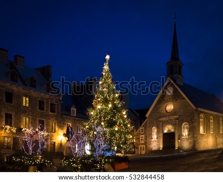 Place Royale (Royal Plaza) and Notre Dame des Victories Church decorated for Christmas at night - Quebec City, Canada