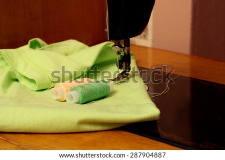 Place seamstresses. Sewing machine, fabric and thread for sewing