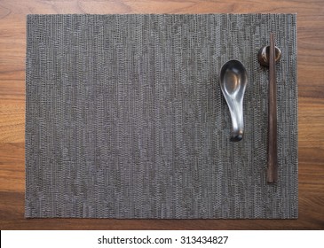 Place Setting For Chinese Food On Wooden Table