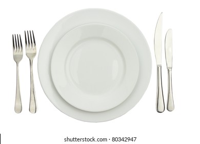 Place Setting With High-gloss Plate, Knife & Fork. Isolated On White.