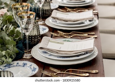 Place setting with menu and name card at elegant shabby chic table