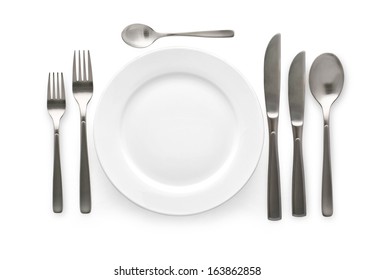 Place Setting With Plate, Knife And Fork. On White Background