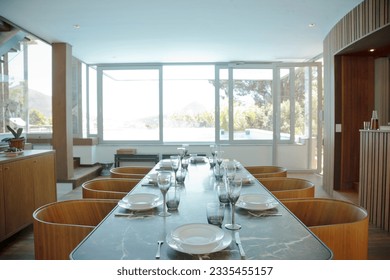 Place settings on table in luxury dining room
