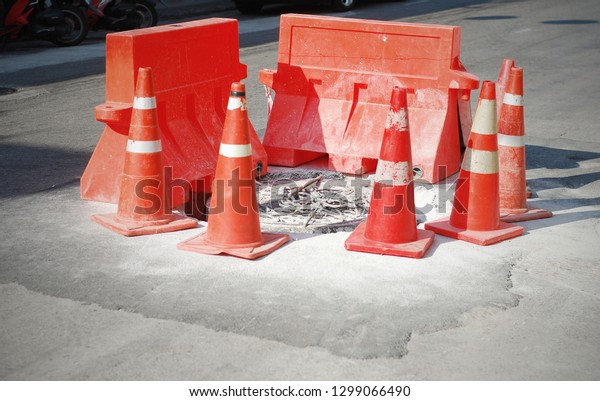 Place the\
traffic cone in the middle of the road to get the car to run\
through the time to improve and repair the\
road