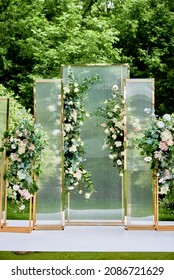 Place For Wedding Ceremony In Garden Outdoors, Copy Space. Wedding Arch Decorated With Flowers. Wedding Setting