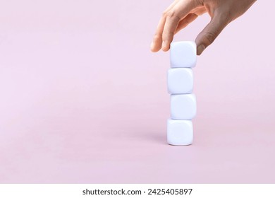 Place white square cube  as a step towards the goal on pink background. Business ideas for successful growth process.