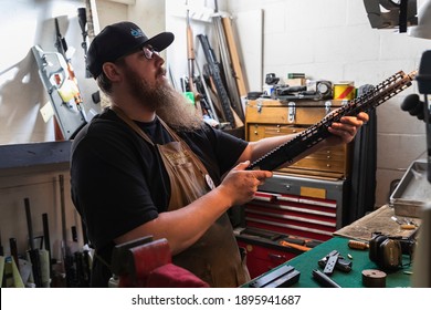 Placerville, USA - November 25, 2020: Gunsmith Working On An 300 Blackout AR Rifle Upper Receiver In A Gun Shop In California